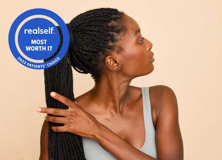 Woman with long, braided hair in a pony tail