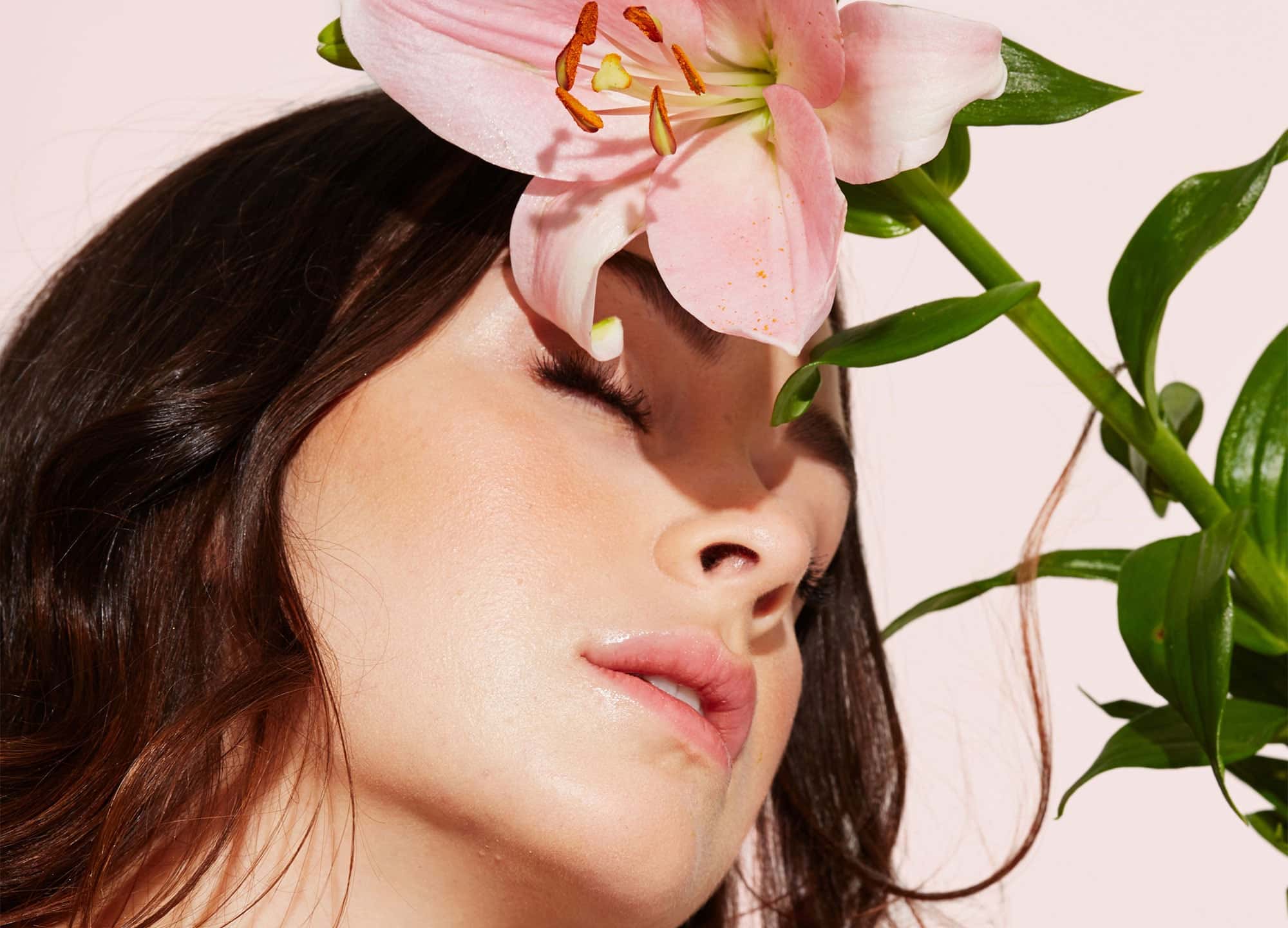 Woman's face with spring flower