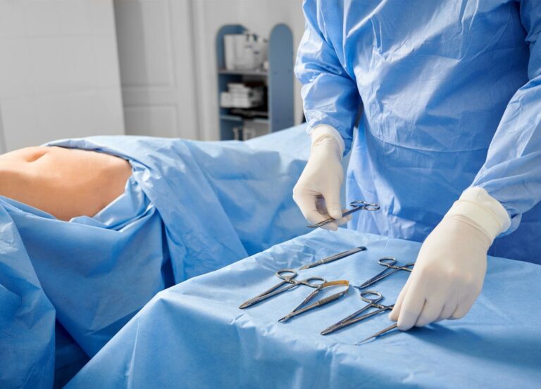 Plastic surgeon preparing to operate on stomach