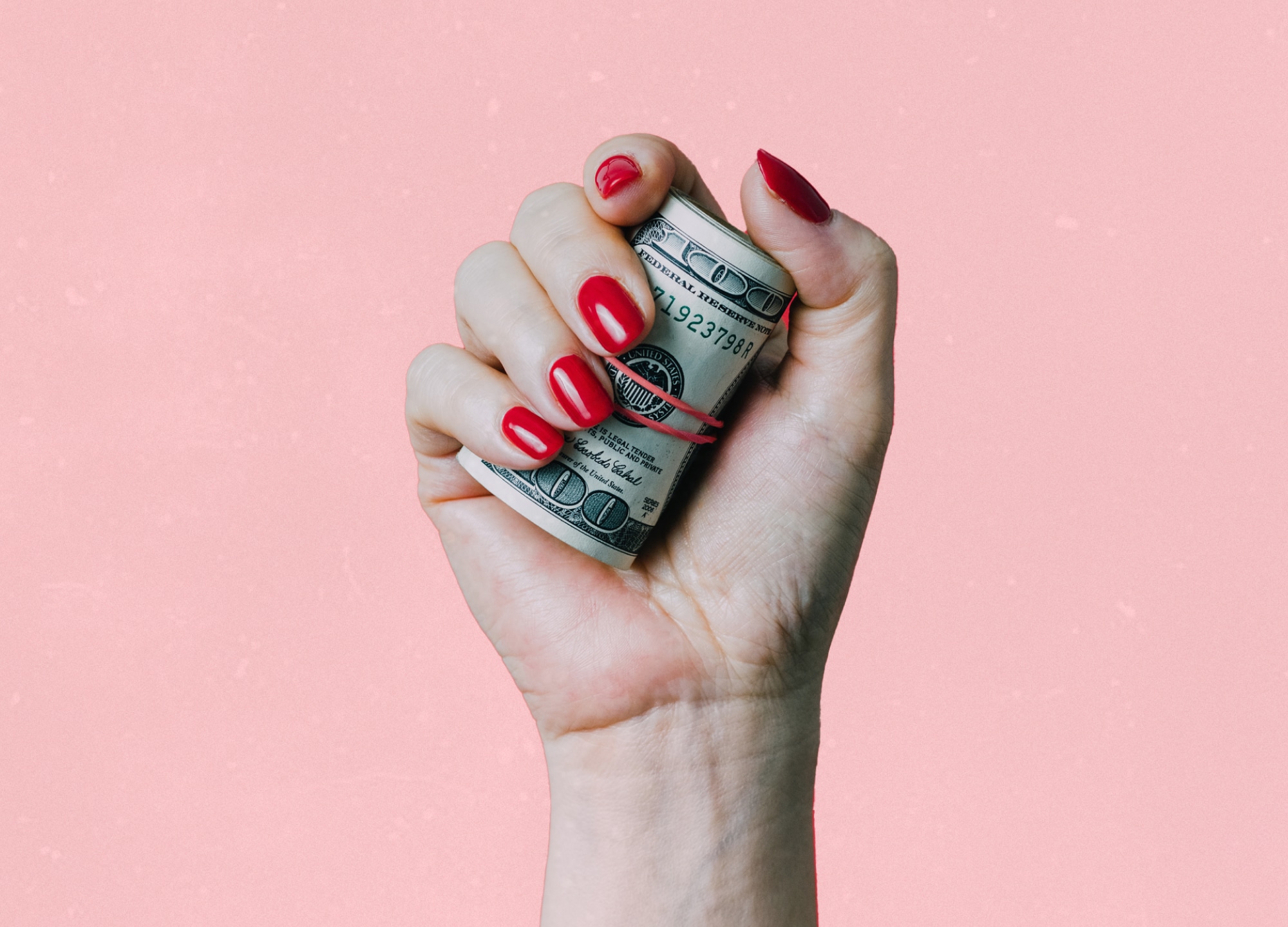 Woman's hand clutching money