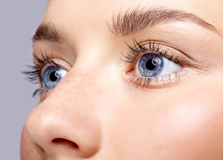 Close up of woman's blue eyes after changing eye color